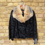 Broadtail lamb coat with raccoon collar